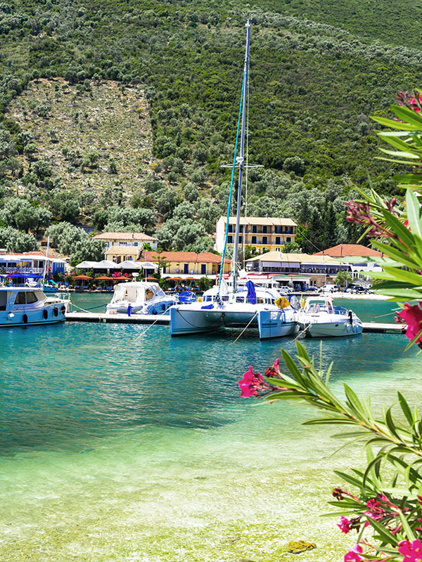 Land for Sale in Lefkada: A captivating view of Sivota in Lefkada, showcasing the tranquil sea and sailing boats, with prime land opportunities awaiting.