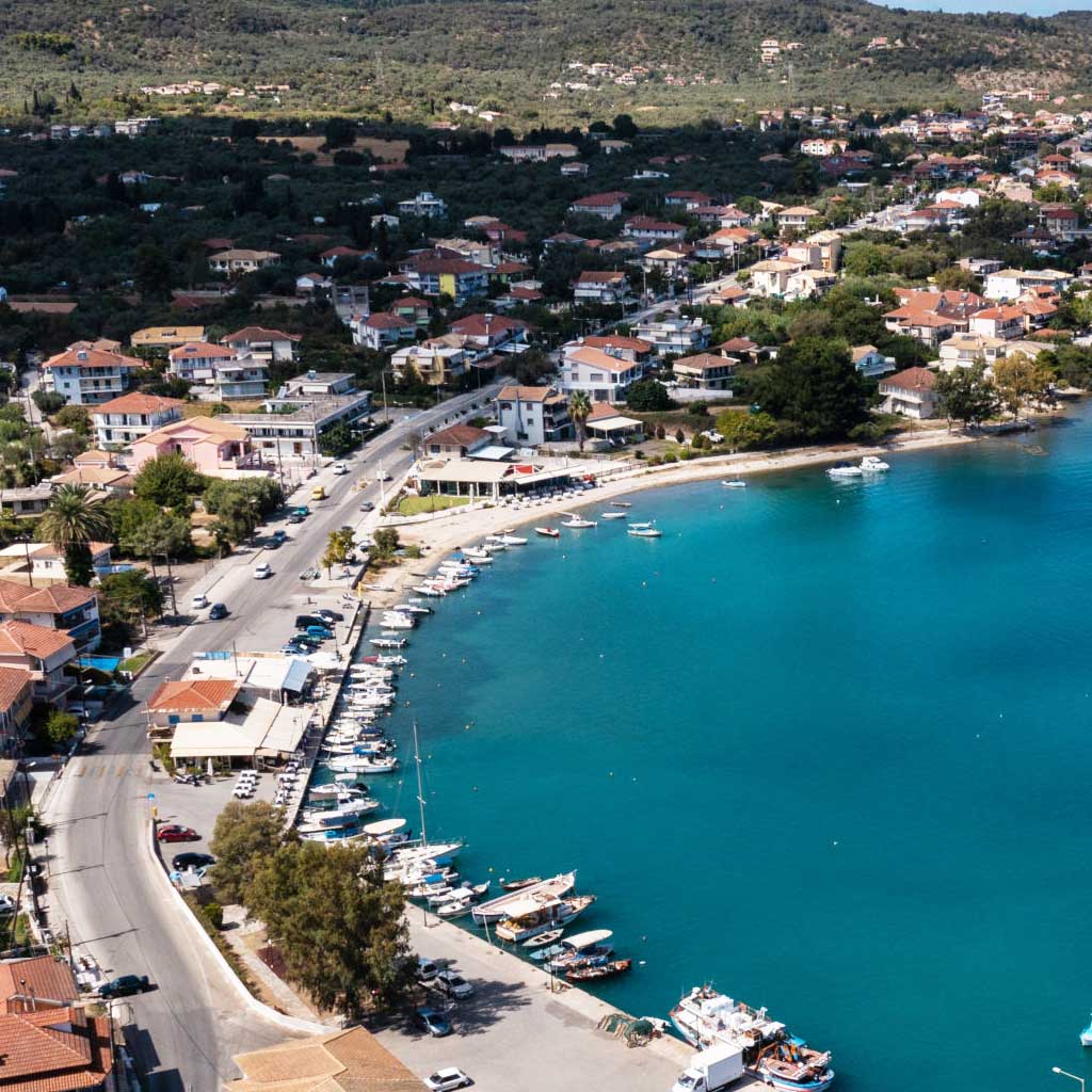 Aerial view of the coastal town Lygia in Lefkada, highlighting local real estate.