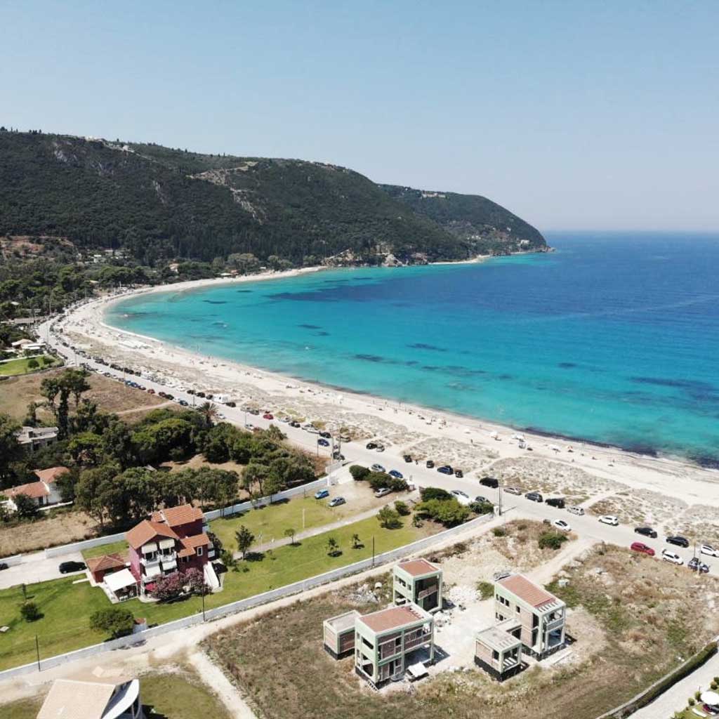 Coastline of Agios Ioannis in Lefkada with emerging real estate by the turquoise sea.