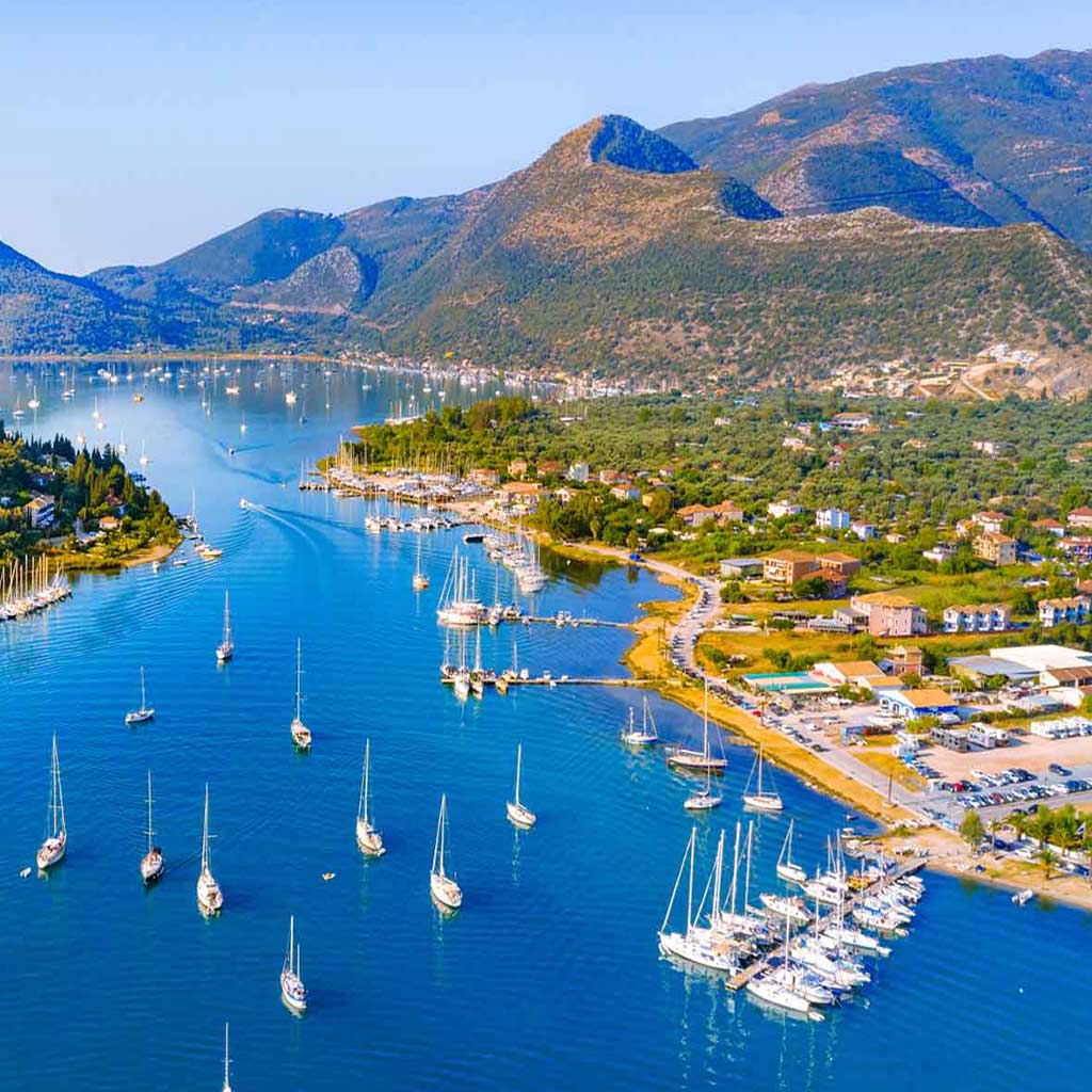 Aerial view of the marina in Nikiana, Lefkada, showcasing attractive real estate opportunities.